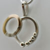 Double Circle Pendant is shown from an angle.