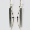 Earrings with a vertical stripe and a sapphire