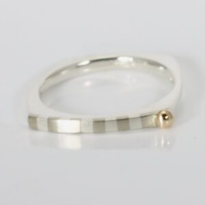 Ring with a square shape. Striped pattern and a 14k ball.