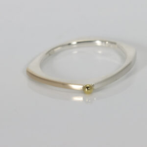 Narrow squarish shaped ring in sterling silver with 14k gold on the top and a 22k gold ball
