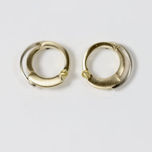 Round contemporary Earrings in 14k white and yellow gold.