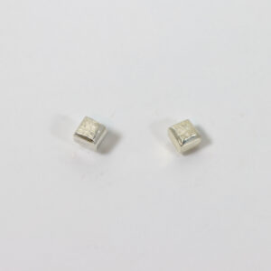 Square and textured stud earring in sterling silver.