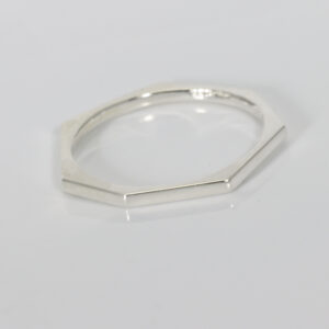 Sterling silver ring. The ring a narrow stackable ring with a heptagon shape.
