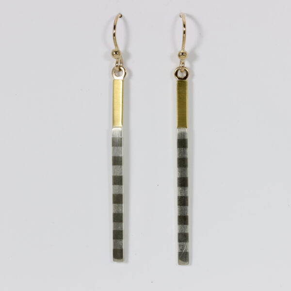 Long narrow dangle earring with 22k accent and a striped pattern