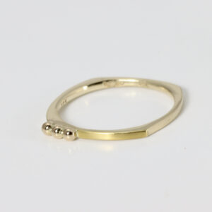 14k yellow gold ring with 22k gold and three little 14k gold balls across the top of the ring.