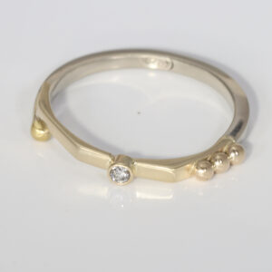 Narrow ring with a diamond and 14k ball detail.