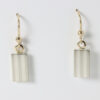Dangle earring with a rectangular striped pattern. Sterling silver with 14k gold ear wires