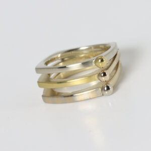 Three bands mixed gold ring. White and yellow gold. Fabricated in 14k with 22k.