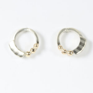 Open Circular stud in sterling silver with a striped pattern and three 14k gold balls.