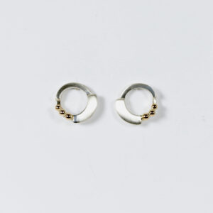 Open tiered circle stud. Hand-fabricated in sterling silver with three little 14k gold balls.