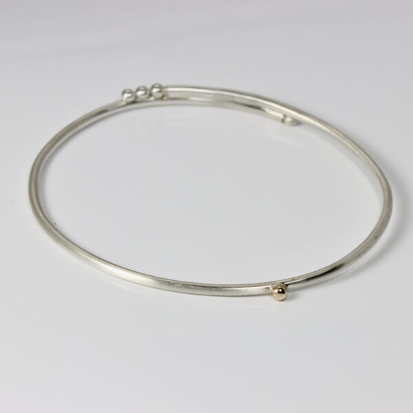 Sterling Silver Bangle with a 14k Gold Ball