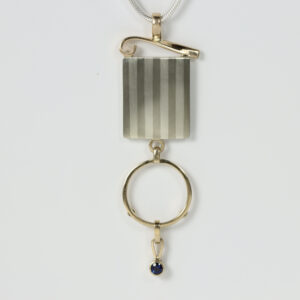 Striped and 14k gold Pendant with a dangling sapphire.