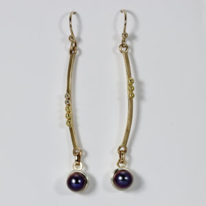 Subtlety unmatched gold dangles. Hand-fabricated in 18, 14k, and 22k gold with a blackpearl.