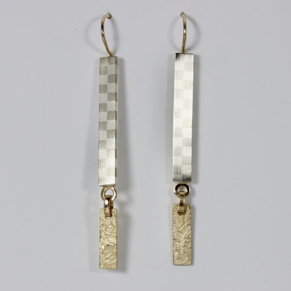 Dangles earrings with a checkerboard pattern and 14k texture.