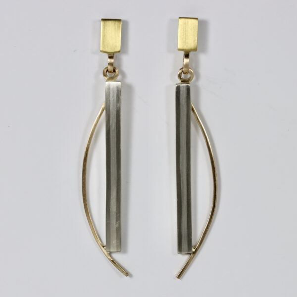 Contemporary mixed metal earrings. Hand fabricated in sterling silver, 14k and 22k gold. Details include a subtle vertical striped pattern.