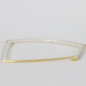 Gold and sterling silver bangle with stripes.