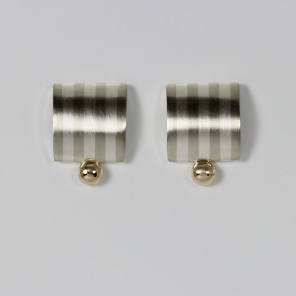 Striped square shaped earring with a slight dome and a solid 14k gold ball centered at the bottom of the earring.