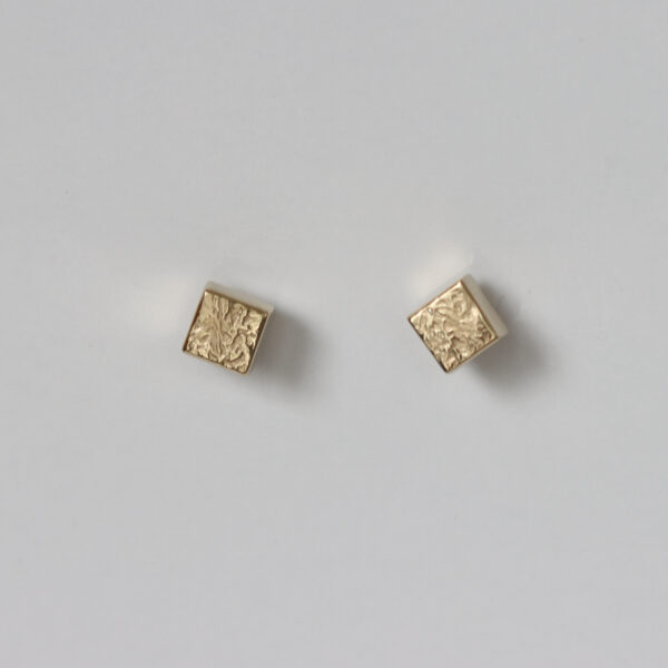 Textured and smooth 14k cube studs.