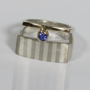Striped Double Band with a Cornflower colored Sapphire.