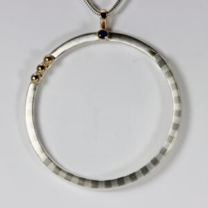Large Round Pendant with a Sapphire