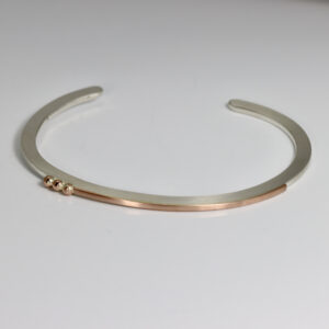 Sterling silver and rose gold cuff bracelet.