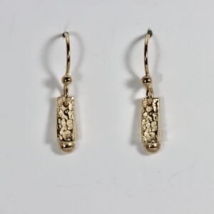 Textured 14k gold dangle earrings.