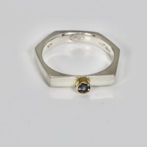 Sterling silver hexagon shaped ring with a spinel gemstone set in a 14k bezel setting.