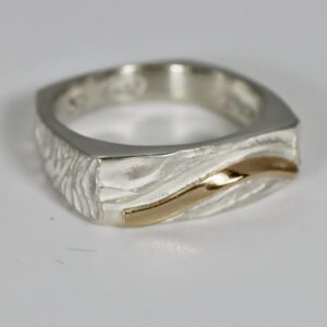 Wavy textured sterling silver ring with 14k detail.