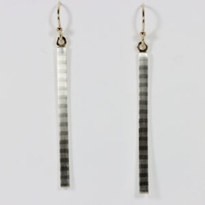 Long, straight, narrow earrings with a subtle striped pattern. Hand-fabricated in sterling siiver and 14k gold.