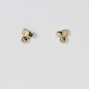 A modern minimalist 14k gold stud earrings. The stud features a tiny flat square shape and a textured square shape seamlessly paired with a miniature round gold ball bead.