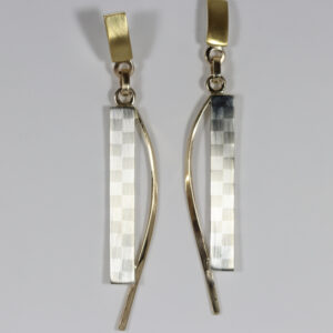 Modern mixed-metal earrings featuring a hand fabricated checkerboard pattern. The top post is 22k over sterling silver with a 14k ear-post. The dangling checkerboard pattern contrast beautifully with the 14k curved detail.