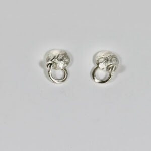 A pair of sterling silver post earrings. Details include interlocking circle shapes and a ball.