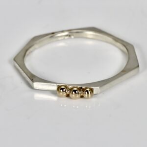 Sterling silver heptagon ring with three little solid 14k gold balls.